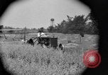Image of tractor-drawn binder United States USA, 1919, second 57 stock footage video 65675070232
