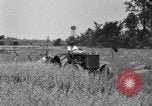 Image of tractor-drawn binder United States USA, 1919, second 58 stock footage video 65675070232