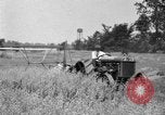 Image of tractor-drawn binder United States USA, 1919, second 59 stock footage video 65675070232