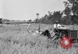 Image of tractor-drawn binder United States USA, 1919, second 60 stock footage video 65675070232