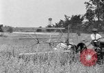 Image of tractor-drawn binder United States USA, 1919, second 61 stock footage video 65675070232