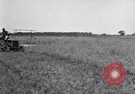 Image of Fordson tractor operating in a field United States USA, 1919, second 5 stock footage video 65675070234