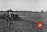 Image of Fordson tractor operating in a field United States USA, 1919, second 11 stock footage video 65675070234