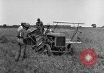 Image of Fordson tractor operating in a field United States USA, 1919, second 14 stock footage video 65675070234