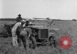 Image of Fordson tractor operating in a field United States USA, 1919, second 21 stock footage video 65675070234