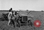 Image of Fordson tractor operating in a field United States USA, 1919, second 26 stock footage video 65675070234