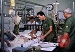 Image of injured man Vietnam, 1968, second 8 stock footage video 65675070270