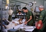 Image of injured man Vietnam, 1968, second 9 stock footage video 65675070270