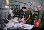Image of injured man Vietnam, 1968, second 11 stock footage video 65675070270