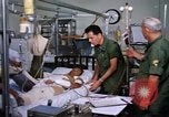 Image of injured man Vietnam, 1968, second 13 stock footage video 65675070270