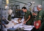 Image of injured man Vietnam, 1968, second 14 stock footage video 65675070270