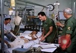 Image of injured man Vietnam, 1968, second 15 stock footage video 65675070270