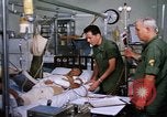 Image of injured man Vietnam, 1968, second 21 stock footage video 65675070270