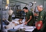 Image of injured man Vietnam, 1968, second 23 stock footage video 65675070270