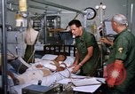 Image of injured man Vietnam, 1968, second 27 stock footage video 65675070270