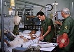 Image of injured man Vietnam, 1968, second 28 stock footage video 65675070270
