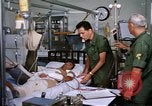 Image of injured man Vietnam, 1968, second 32 stock footage video 65675070270