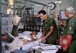 Image of injured man Vietnam, 1968, second 33 stock footage video 65675070270