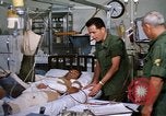 Image of injured man Vietnam, 1968, second 36 stock footage video 65675070270