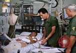 Image of injured man Vietnam, 1968, second 37 stock footage video 65675070270