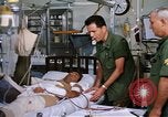 Image of injured man Vietnam, 1968, second 38 stock footage video 65675070270