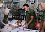 Image of injured man Vietnam, 1968, second 39 stock footage video 65675070270