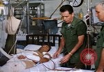 Image of injured man Vietnam, 1968, second 43 stock footage video 65675070270