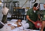 Image of injured man Vietnam, 1968, second 45 stock footage video 65675070270