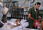 Image of injured man Vietnam, 1968, second 46 stock footage video 65675070270