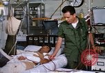 Image of injured man Vietnam, 1968, second 52 stock footage video 65675070270