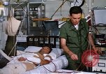 Image of injured man Vietnam, 1968, second 59 stock footage video 65675070270