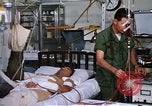 Image of injured man Vietnam, 1968, second 60 stock footage video 65675070270