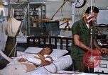 Image of injured man Vietnam, 1968, second 62 stock footage video 65675070270