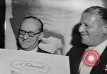 Image of invitational preview of film "Man of a Thousand Faces" New York City USA, 1957, second 33 stock footage video 65675070397