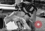 Standbild Mann angeln gehen und Waschbecken kleinen Boot Florida United States USA, 1961, aus Sekunde 35 historischem Filmmaterial Videoclip 65675070432