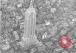 Image of Empire State Building on opening day New York City USA, 1931, second 18 stock footage video 65675070440