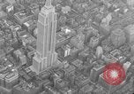Image of Empire State Building on opening day New York City USA, 1931, second 23 stock footage video 65675070440