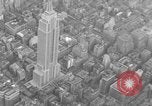 Image of Empire State Building on opening day New York City USA, 1931, second 25 stock footage video 65675070440