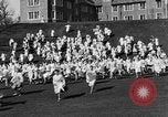Image of annual hoop roll Wellesley Massachusetts USA, 1931, second 25 stock footage video 65675070441