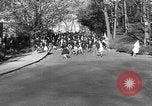 Image of annual hoop roll Wellesley Massachusetts USA, 1931, second 40 stock footage video 65675070441