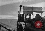 Image of wheat harvested by mule drawn combines United States USA, 1936, second 35 stock footage video 65675070601