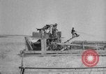 Image of wheat harvested by mule drawn combines United States USA, 1936, second 46 stock footage video 65675070601