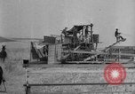 Image of wheat harvested by mule drawn combines United States USA, 1936, second 47 stock footage video 65675070601