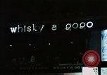 Standbild Whisky a Gogo Leuchtreklame Soho Soho London England United Kingdom, 1968, aus Sekunde 1 historischem Filmmaterial Videoclip 65675070676