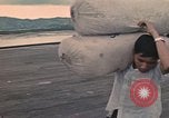 Image of ethnic Vietnamese fleeing Cambodia Vung Tau Vietnam, 1970, second 26 stock footage video 65675070855