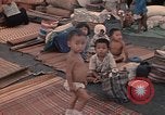 Image of ethnic Vietnamese fleeing Cambodia Vung Tau Vietnam, 1970, second 31 stock footage video 65675070855