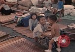 Image of ethnic Vietnamese fleeing Cambodia Vung Tau Vietnam, 1970, second 33 stock footage video 65675070855