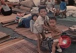 Image of ethnic Vietnamese fleeing Cambodia Vung Tau Vietnam, 1970, second 34 stock footage video 65675070855