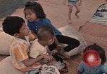 Image of ethnic Vietnamese fleeing Cambodia Vung Tau Vietnam, 1970, second 40 stock footage video 65675070855