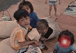 Image of ethnic Vietnamese fleeing Cambodia Vung Tau Vietnam, 1970, second 41 stock footage video 65675070855